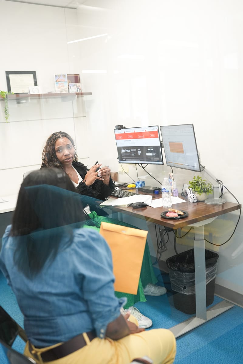 Entrepreneur reviewing business plans at a desk