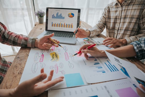 People reviewing business performance charts