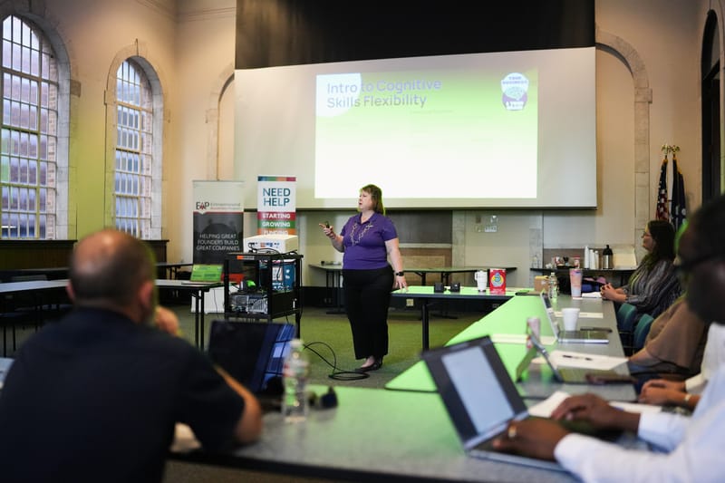 Business professional presenting growth strategy to team