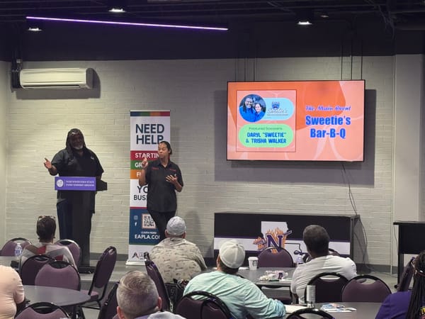 Entrepreneurs presenting business ideas to peers