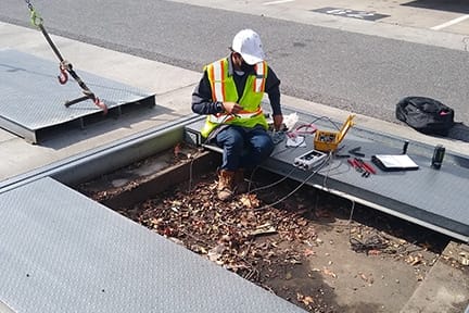Michelli technician repairing scale equipment