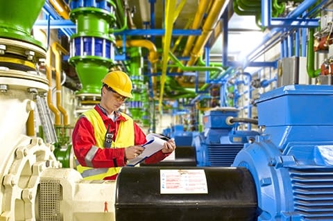 Michelli technician cleaning and checking a platform scale for debris buildup and component wear