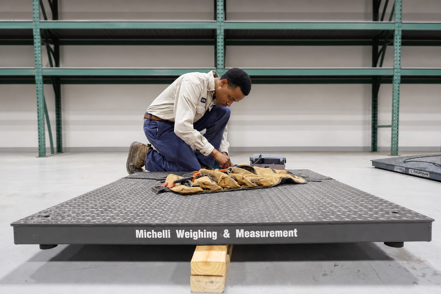 Energy facility with industrial weighing and measurement equipment used for production, loadout, and data tracking