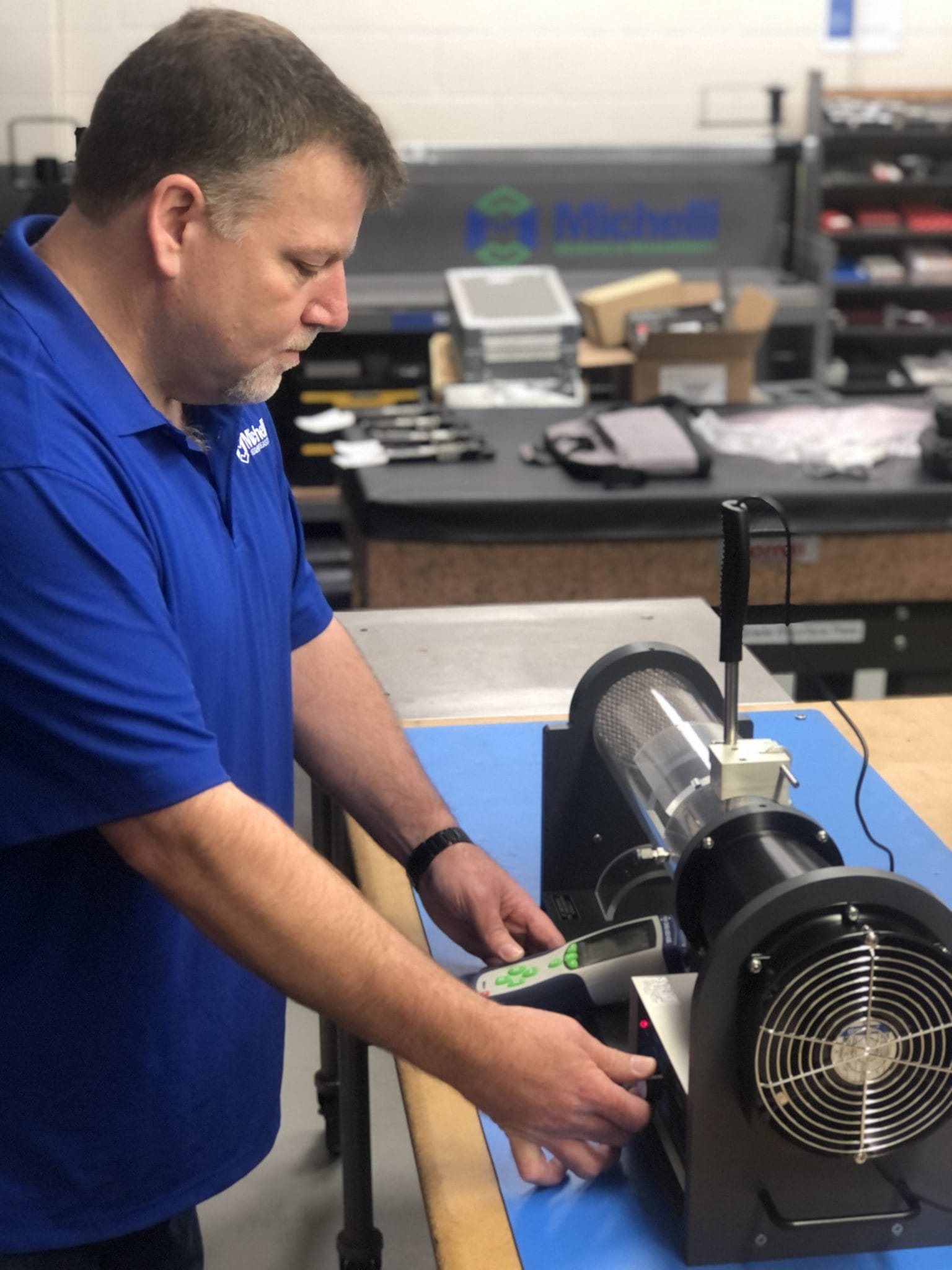 Michelli technician calibrating an environmental measurement instrument against a controlled reference standard