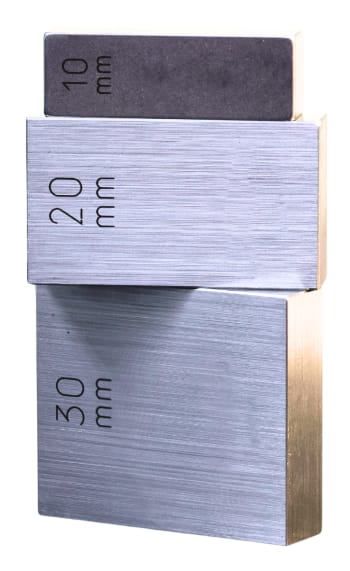 Stacked gage blocks demonstrating wringing technique