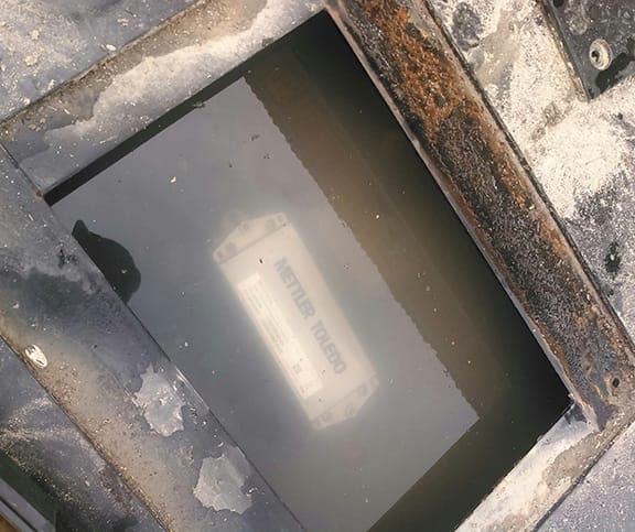 Flooded junction box on a truck scale submerged in water