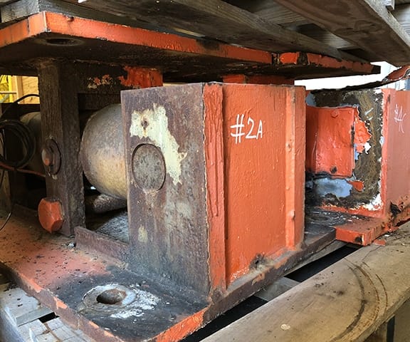A load cell heavily corroded by salt water exposure