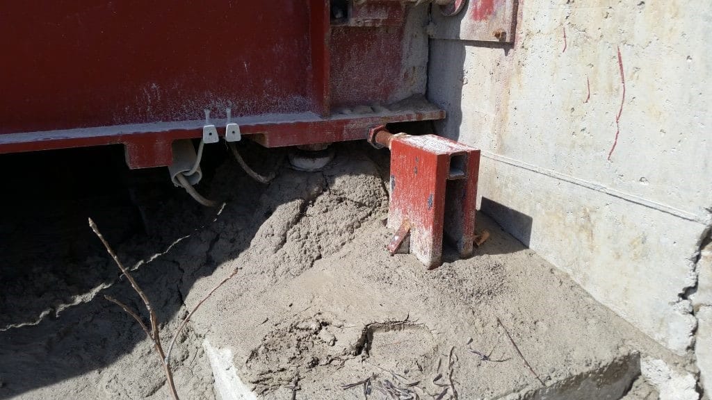 Serious debris buildup around the load cell of a truck scale