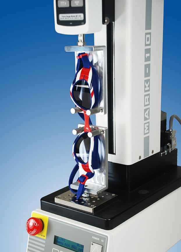 Mark-10 force measurement test stand being used to test swim goggle durability