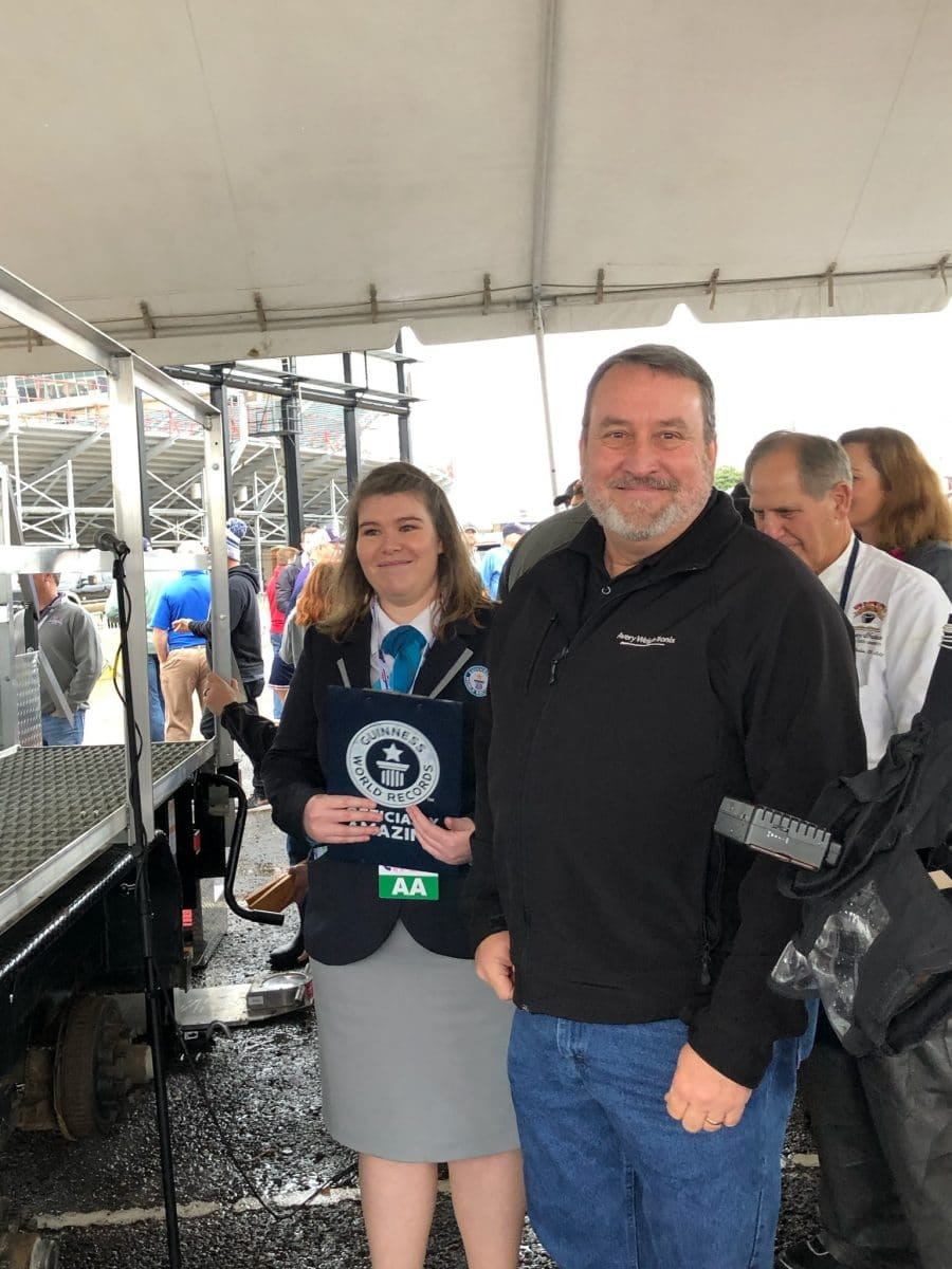 Michelli Corporate Secretary Bobby McDill with the Guinness Book of World Records representative on site