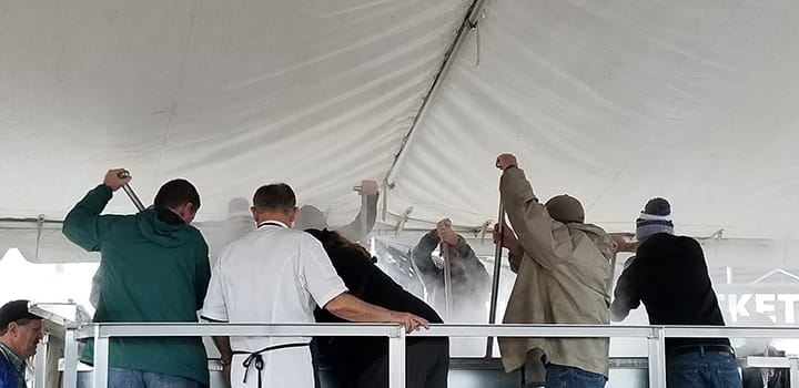 Chef John Folse and team stirring the World's Largest Pot of Gumbo