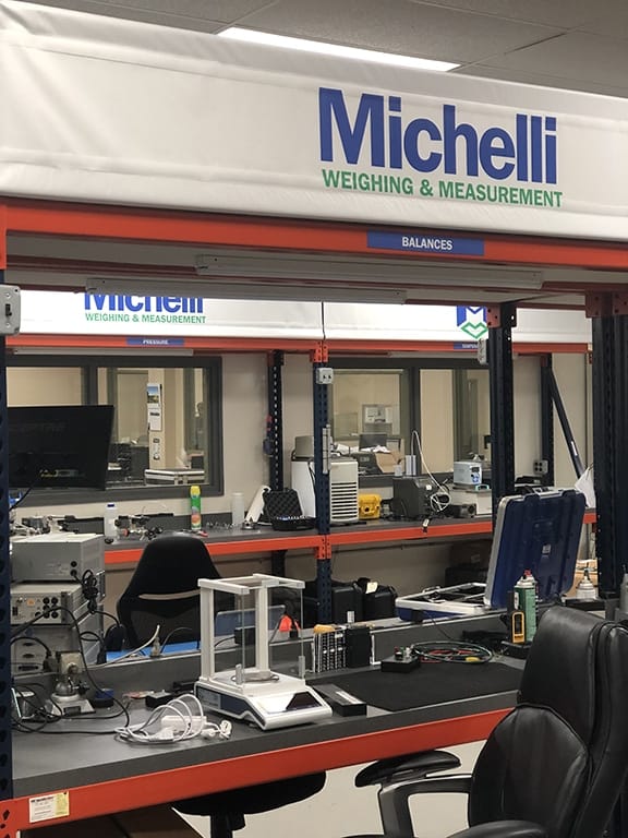 Laboratory balance calibration work station showing analytical balances in Michelli calibration lab