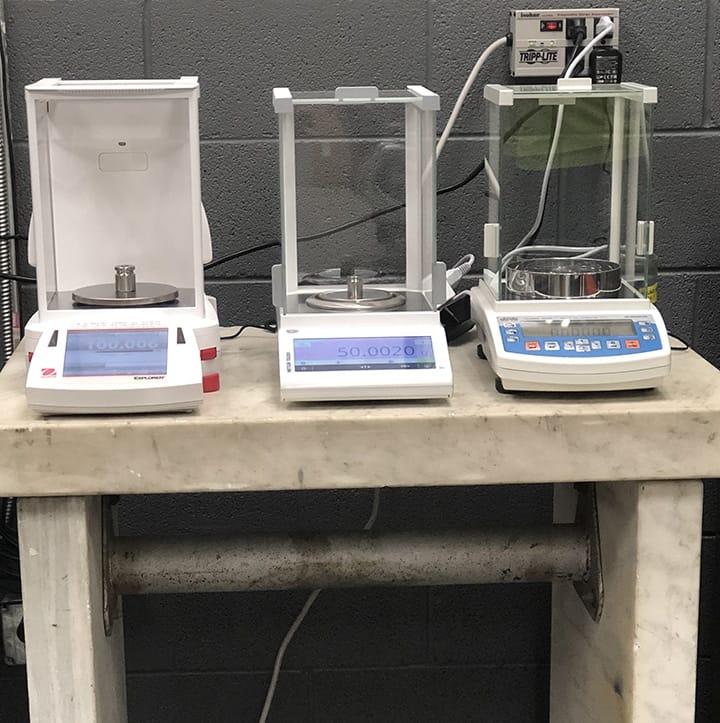 Test weight calibration in progress at Michelli mass calibration work station