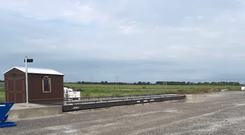 Rural weigh station with a small shed and empty scale platform