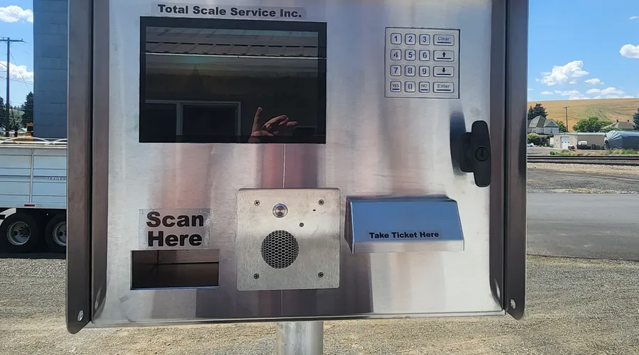 Outdoor unmanned scale service terminal with keypad, screen, and ticket slot