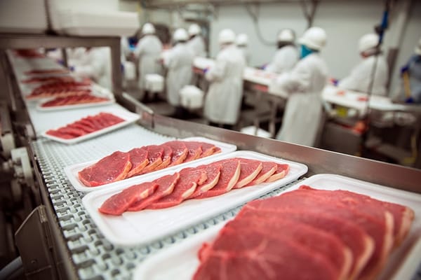 Washdown-safe stainless floor scale in a food and beverage production environment used for ingredient and package weighing