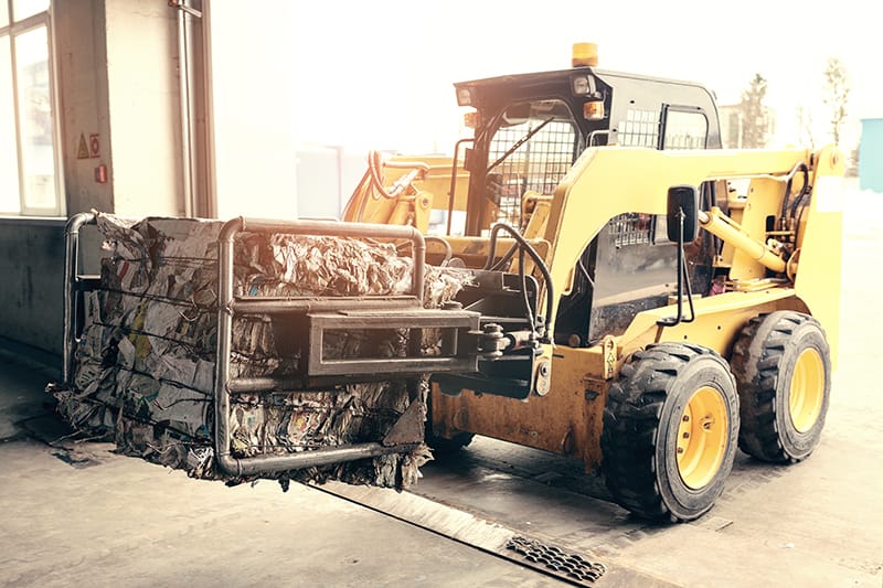 Waste and recycling facility with truck scale used for inbound and outbound material weighing and transaction records