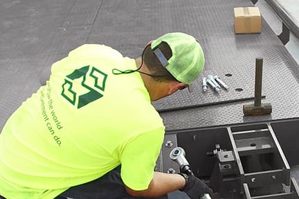 Michelli Weighing & Measurement technician performing truck scale installation at an industrial facility