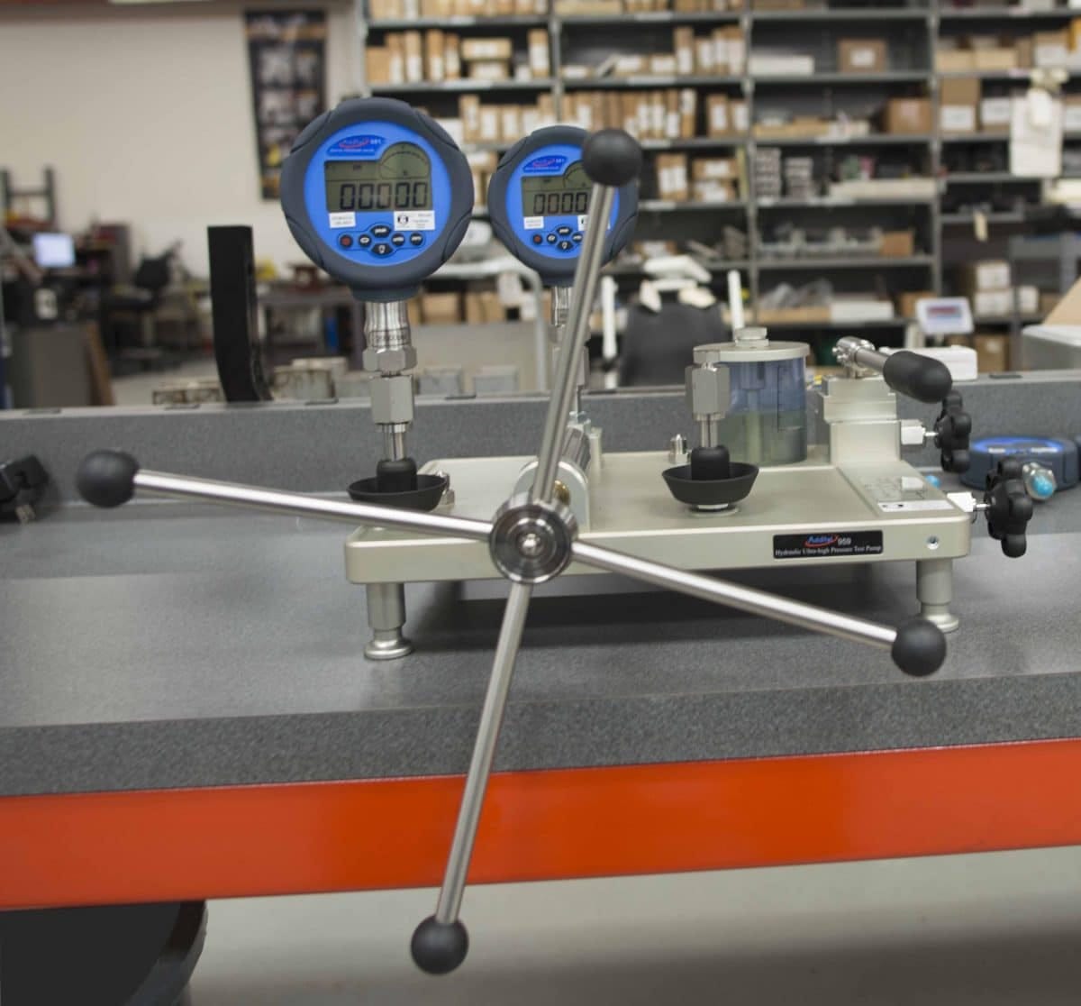 Deadweight tester and digital pressure calibrator used for calibrating pressure gauges and transmitters