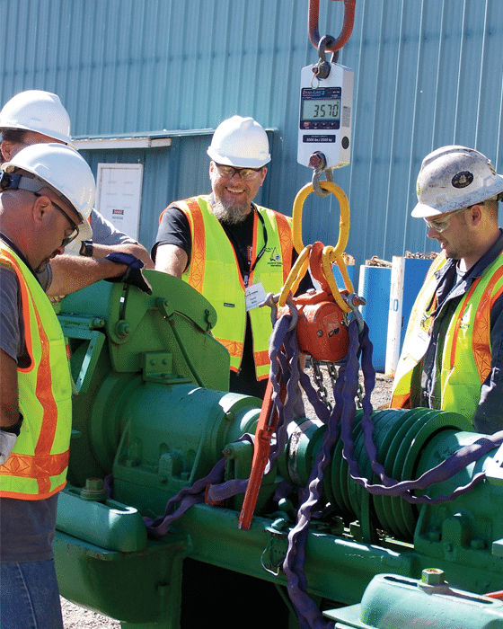 Workers gathered around a Rice Lake Dynamometer