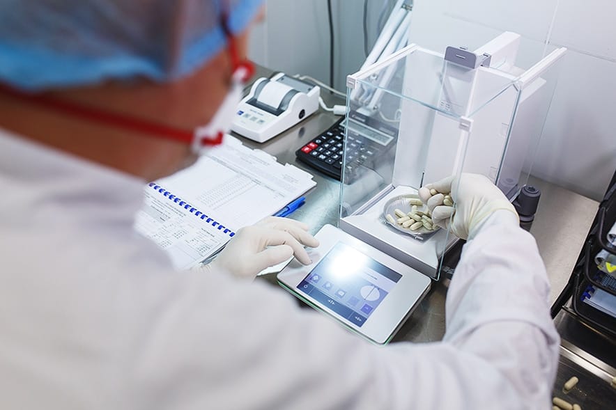 Precision analytical balance in a laboratory used for sample weighing, formulation checks, and quality documentation