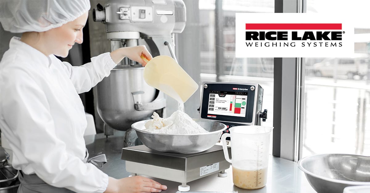 A woman utilizes the Rice Lake Myrias Production Management Software to measure flour on a scale