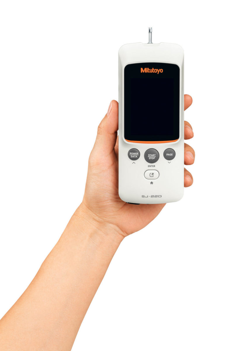 Hand holding Mitutoyo SJ-220 Surftest