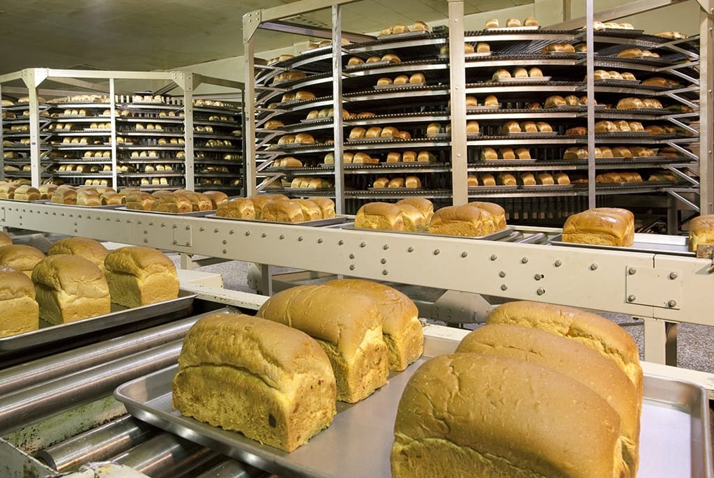 In-motion checkweigher on a food and beverage production line used for package weight verification and quality control