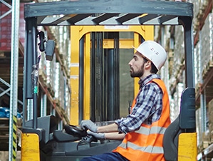 Forklift scale in a warehouse environment used to weigh pallets and freight during receiving and staging operations