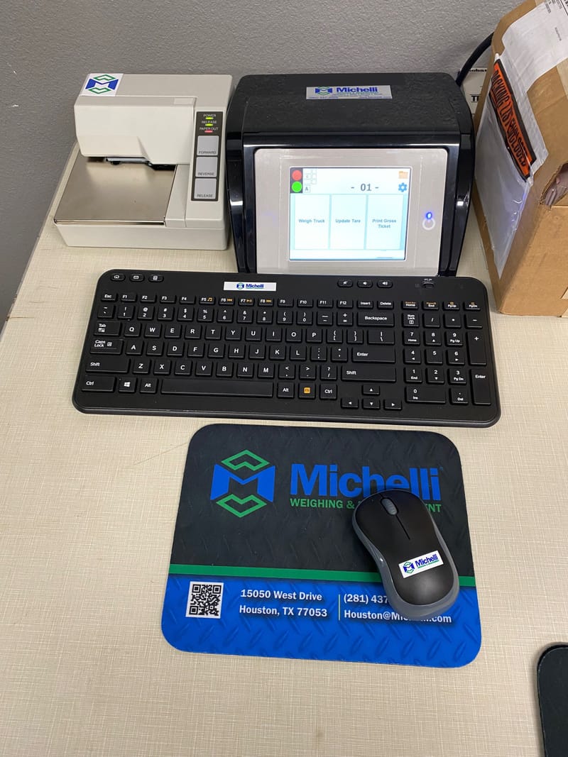 Workstation setup with Michelli weighing equipment, monitor, and printer at an operator station