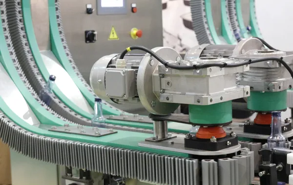 Industrial conveyor system in operation representing VFFS packaging and filling line applications