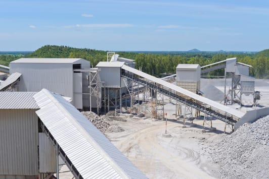 Industrial quarry facility with conveyors and limestone crushing plant