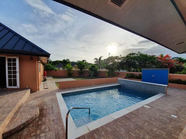 Ashbury Villa pool area at sunset