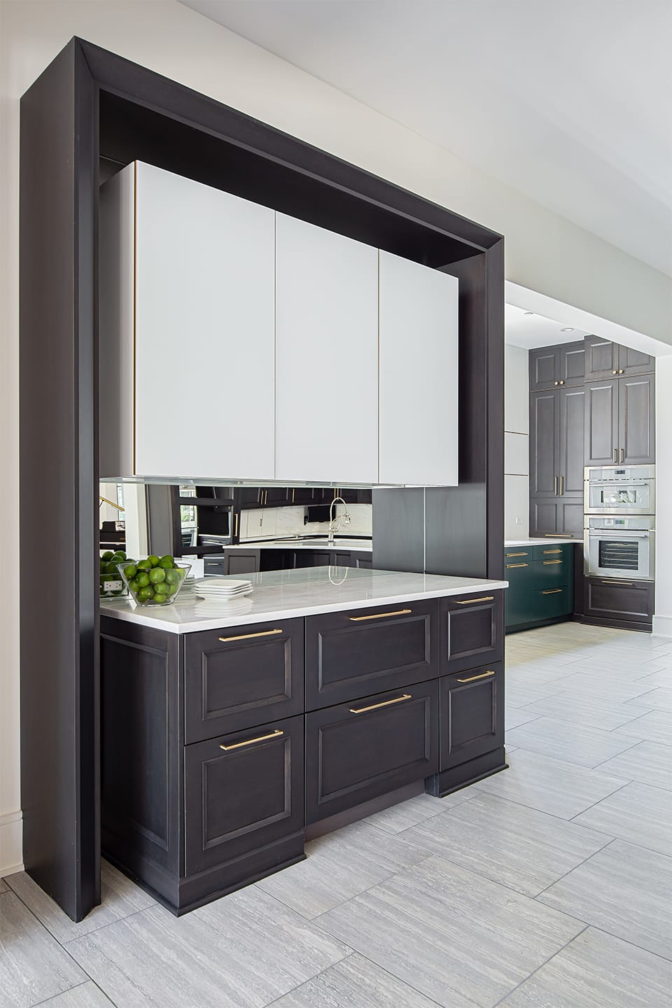 Floating frosted glass cabinet against mirrored wall