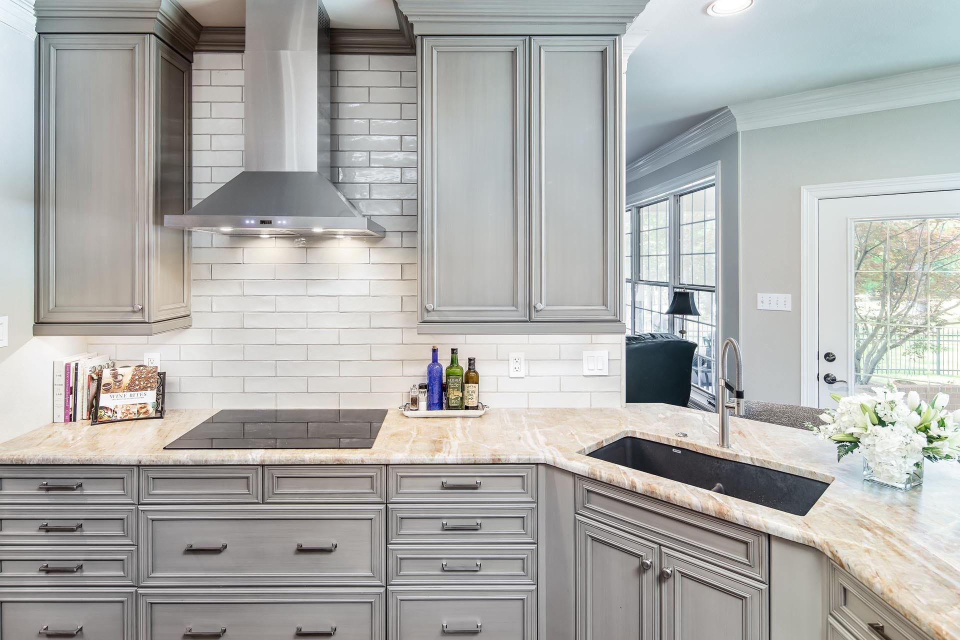 Luxury kitchen with custom island and appliances by The Cottage