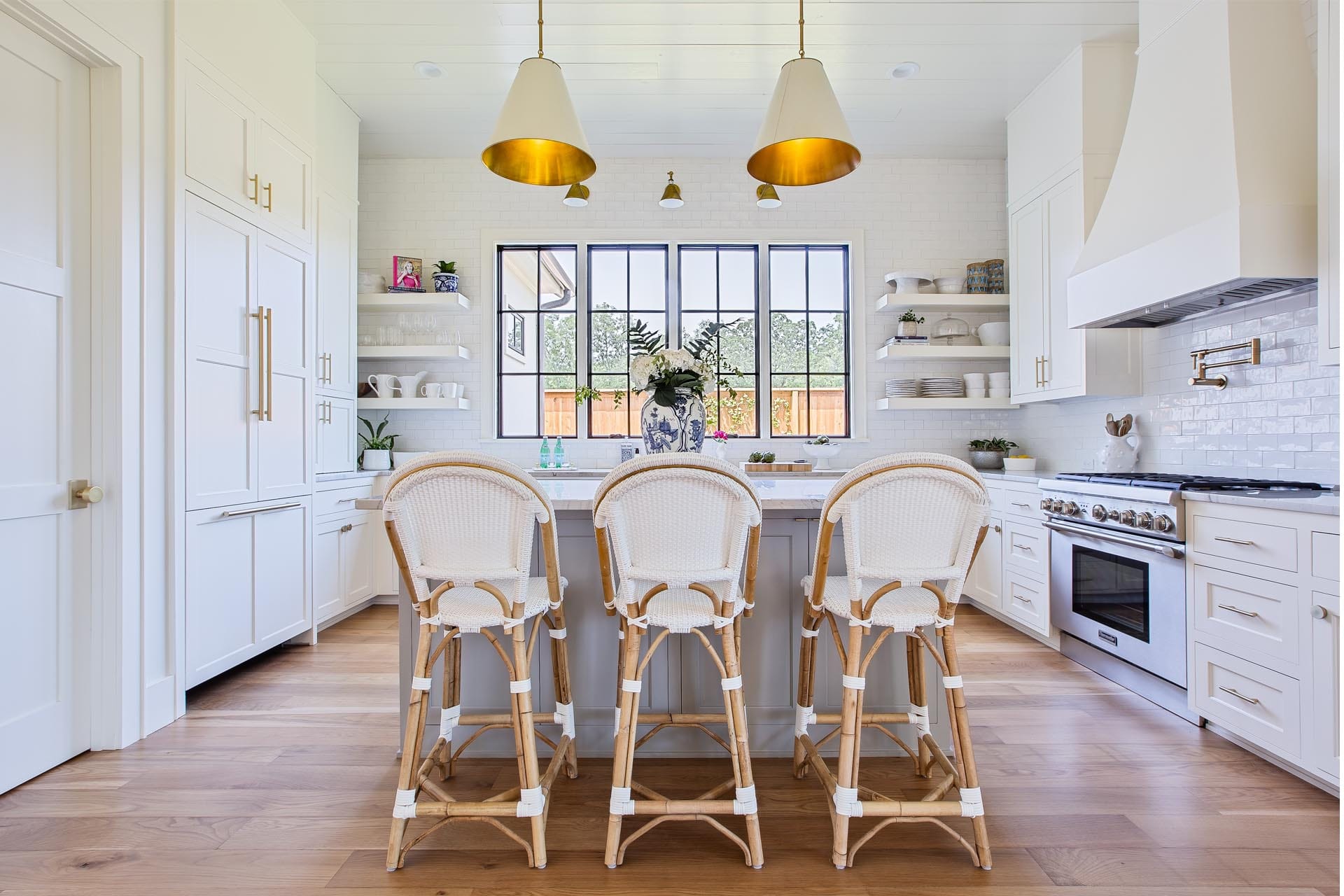 Custom kitchen cabinetry and stone countertops by The Cottage