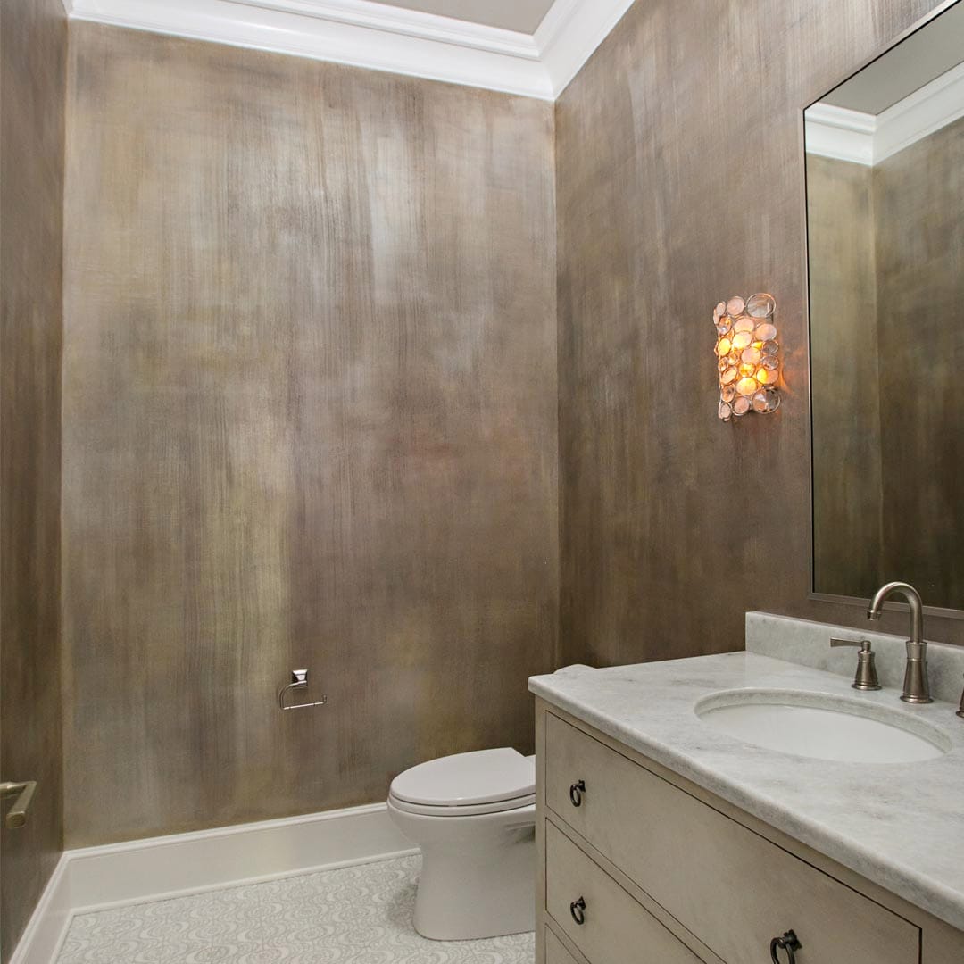 Luxury bathroom with marble surfaces and premium fixtures by The Cottage