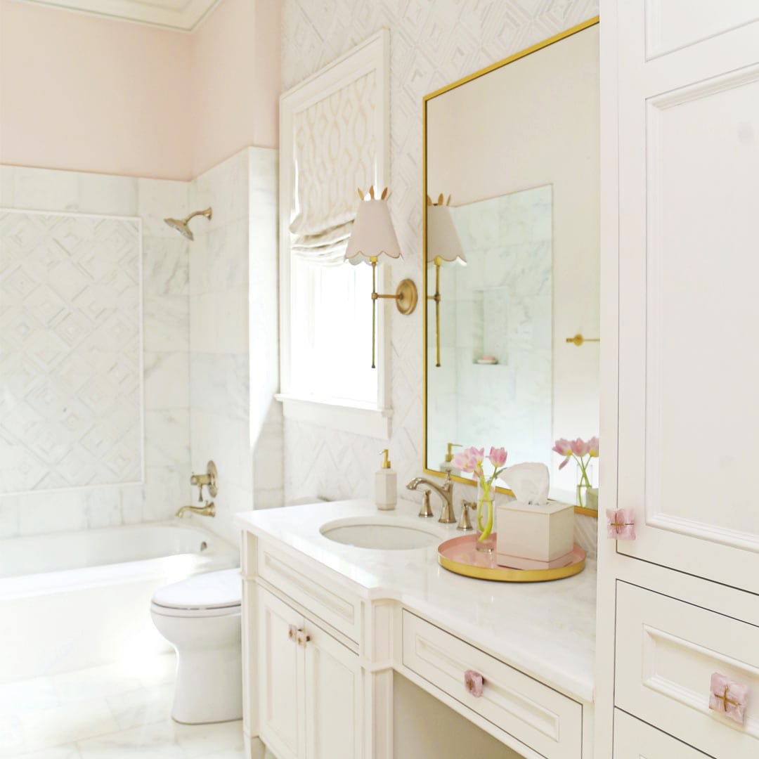 Designer bathroom with walk-in shower and soaking tub by The Cottage