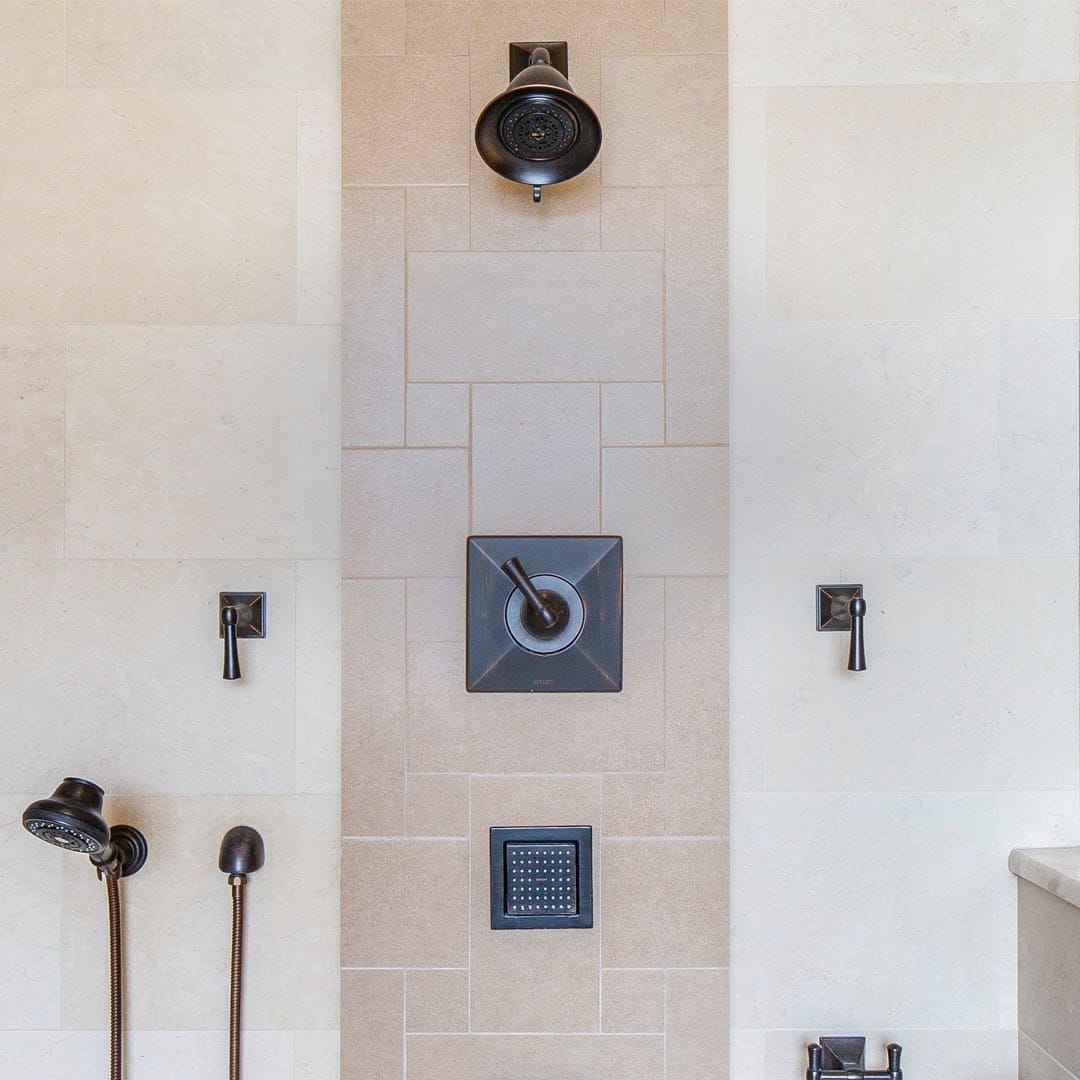High-end master bath with radiant heat and premium tile by The Cottage