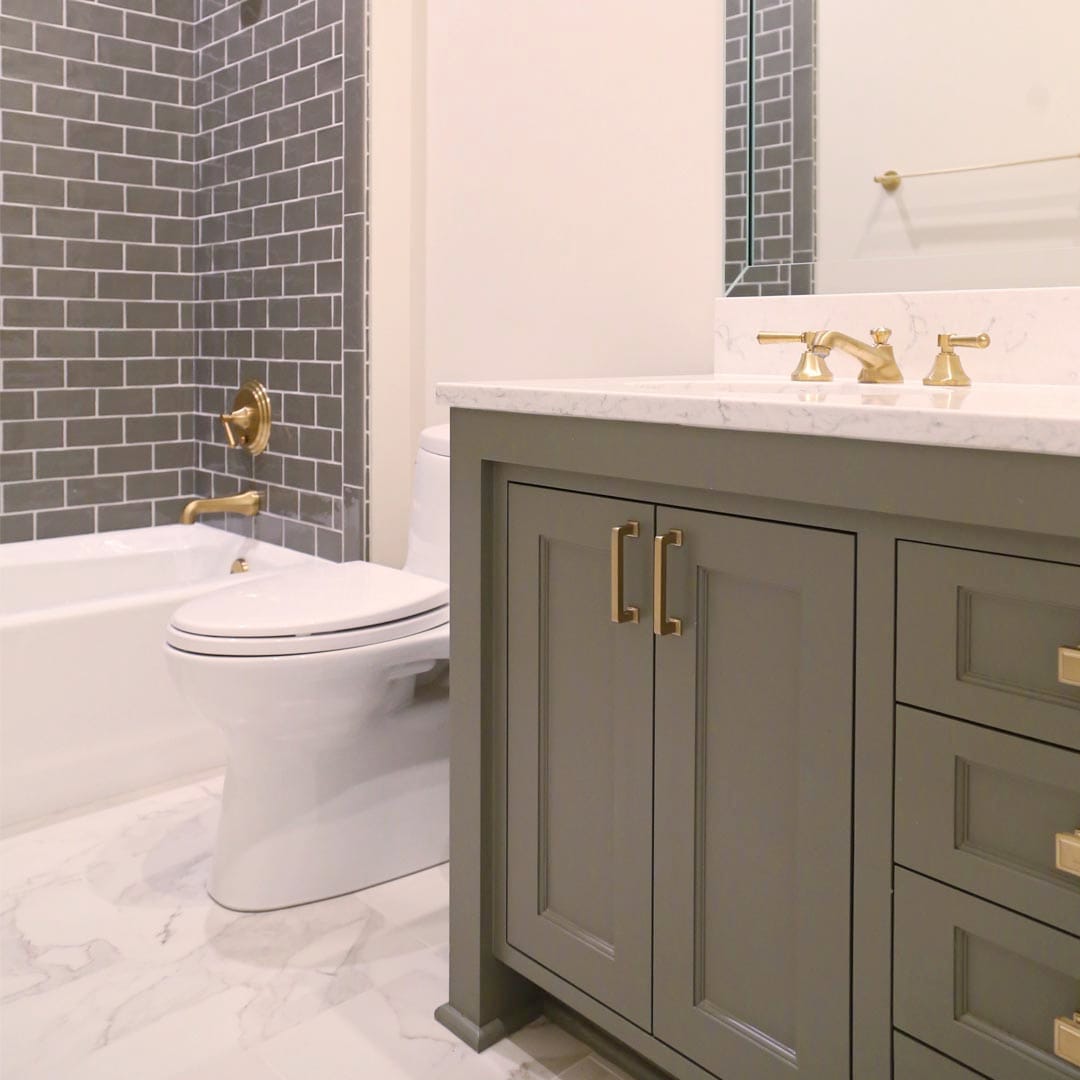 Designer bathroom with WarmlyYours radiant heated floors by The Cottage